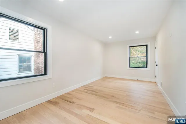 a white toilet sitting next to a bath tub