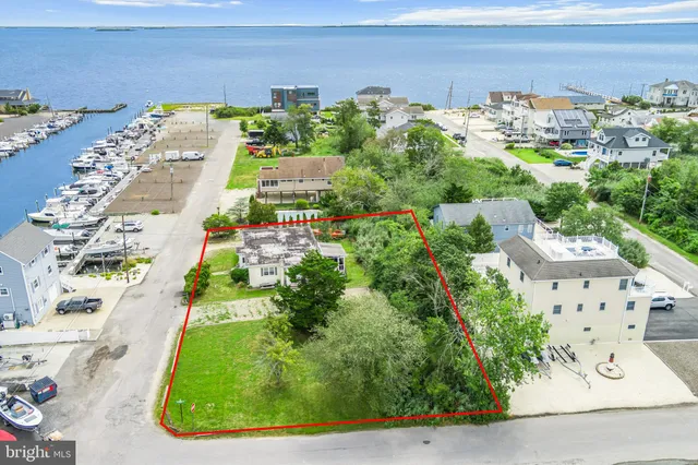 an aerial view of a residential houses with outdoor space
