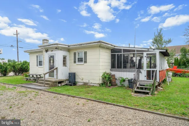a front view of a house with a yard and porch