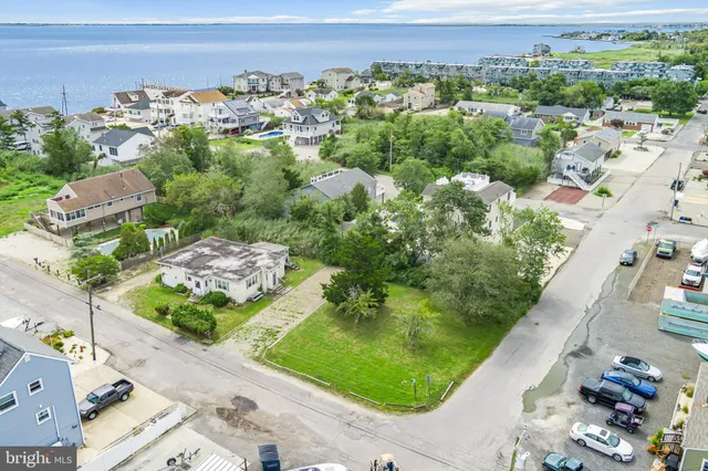 an aerial view of a golf course with parking space