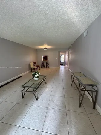 a room with gym equipment and a large window