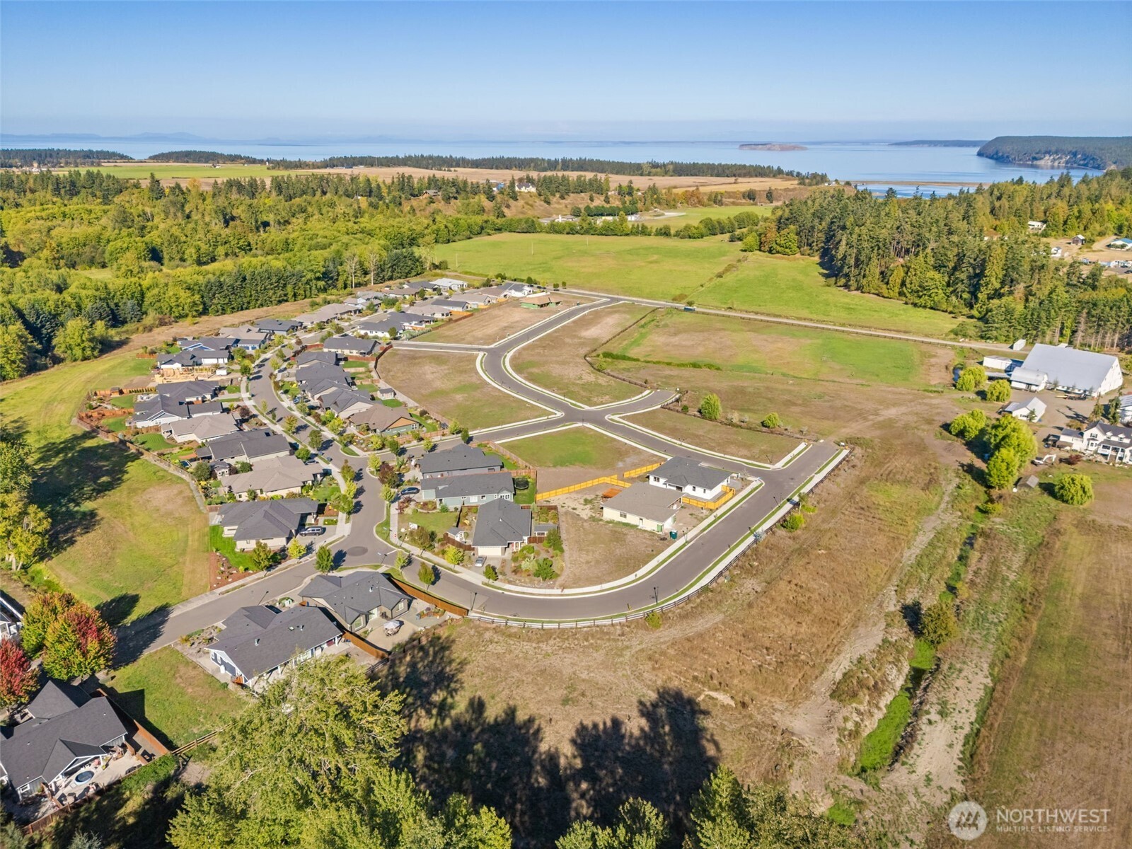 61 Dover Lane Sequim, WA 98382 - Photo 16 of 20 a view of a swimming pool with an ocean view