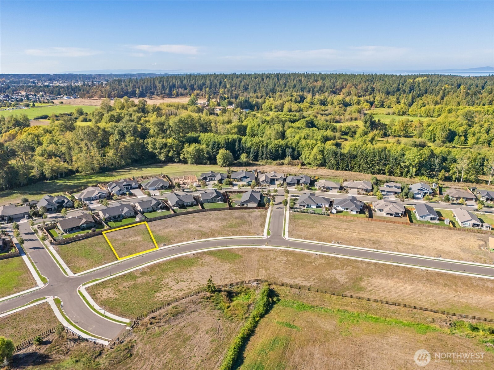 61 Dover Lane Sequim, WA 98382 - Photo 2 of 20 a view of a swimming pool and an ocean view