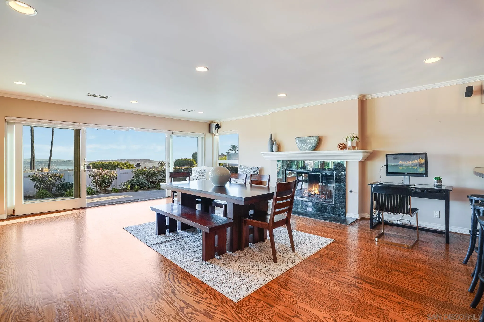 5730 Rutgers Road La Jolla, CA 92037 - Photo 14 of 54 a living room with furniture a wooden floor and next to a window