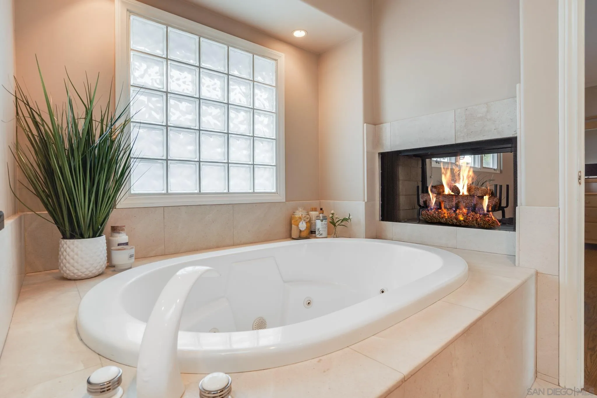 5730 Rutgers Road La Jolla, CA 92037 - Photo 19 of 54 a white bath tub sitting in a bathroom next to a window