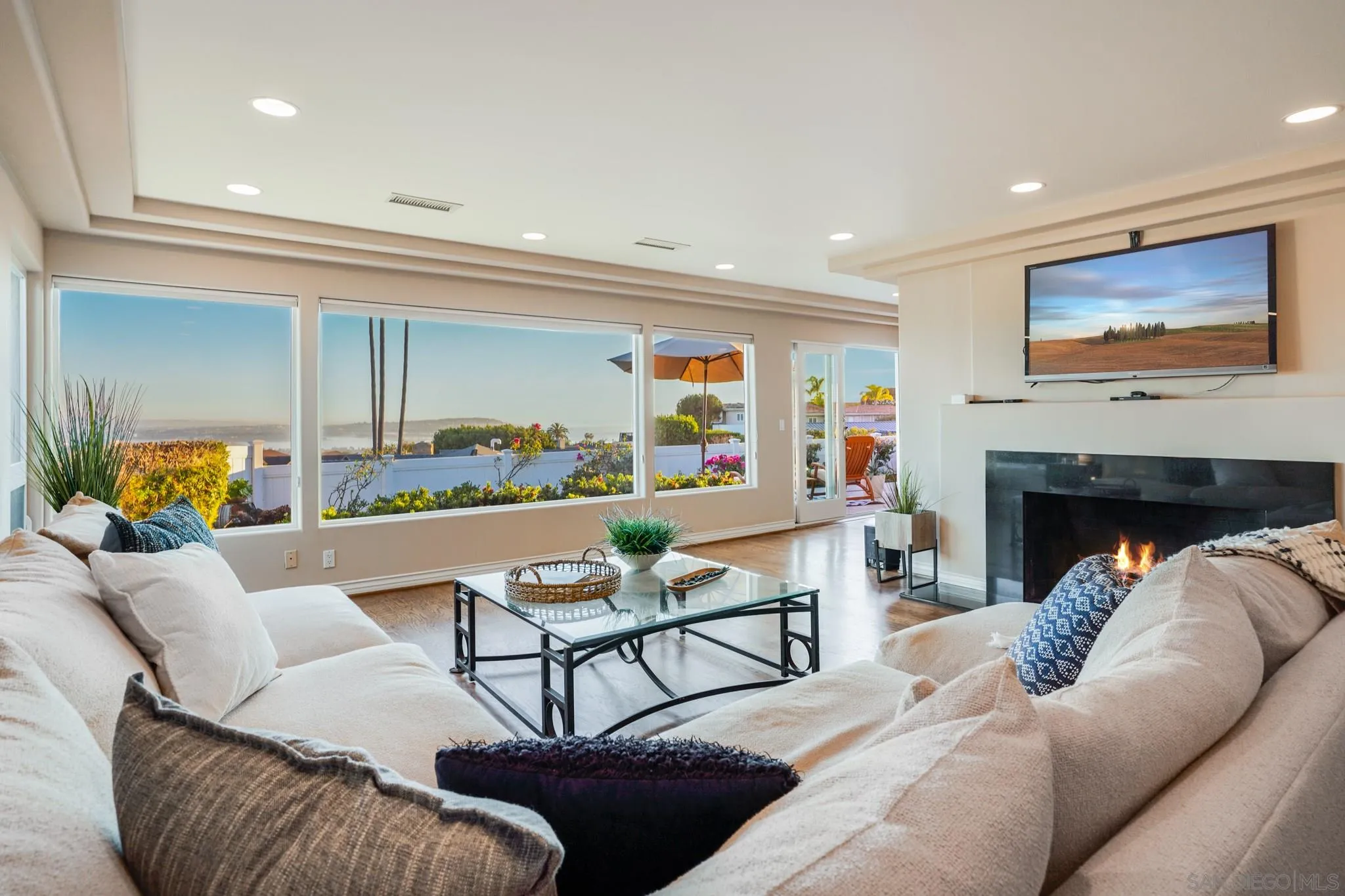 5730 Rutgers Road La Jolla, CA 92037 - Photo 22 of 54 a living room with furniture and a flat screen tv