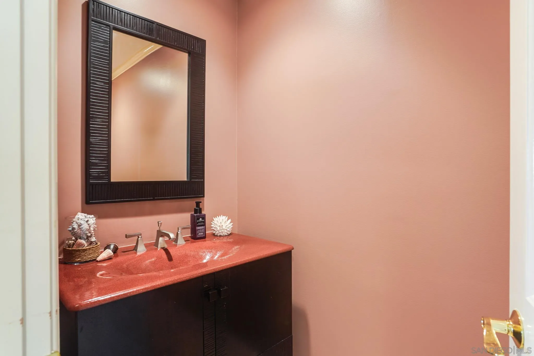5730 Rutgers Road La Jolla, CA 92037 - Photo 23 of 54 a bathroom with a sink and a mirror