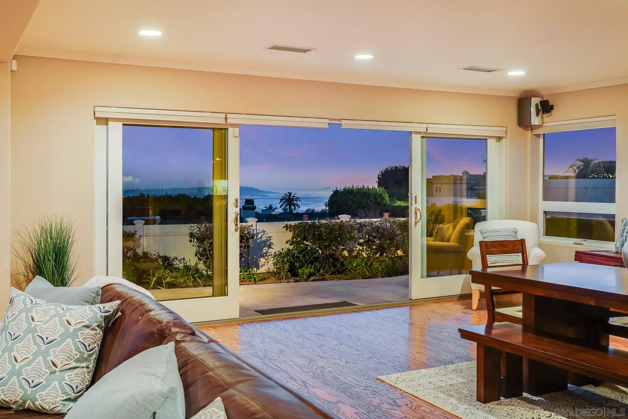 5730 Rutgers Road La Jolla, CA 92037 - Photo 25 of 54 a living room with furniture a rug and a floor to ceiling window