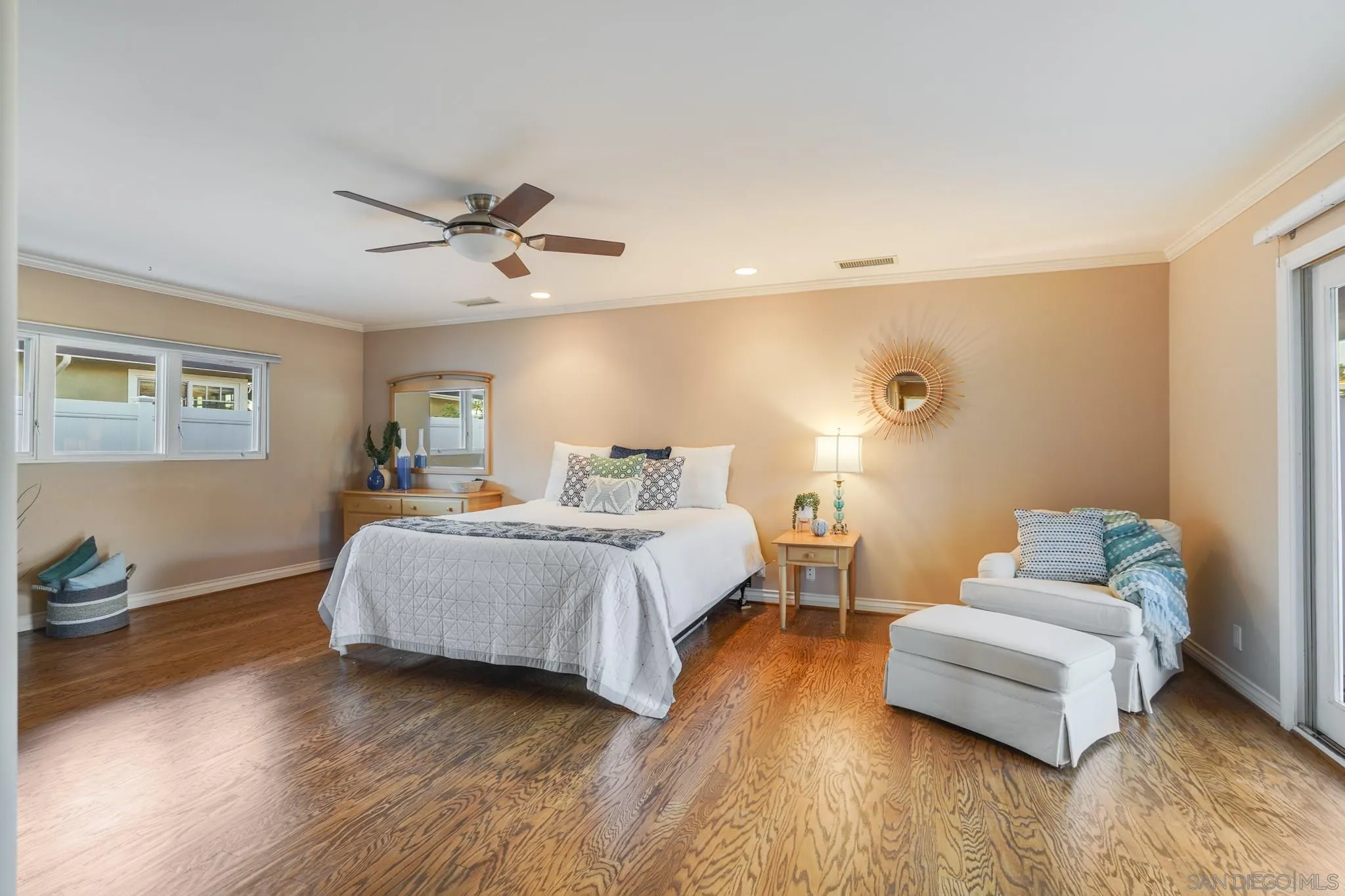 5730 Rutgers Road La Jolla, CA 92037 - Photo 29 of 54 a spacious bedroom with a bed and a couch