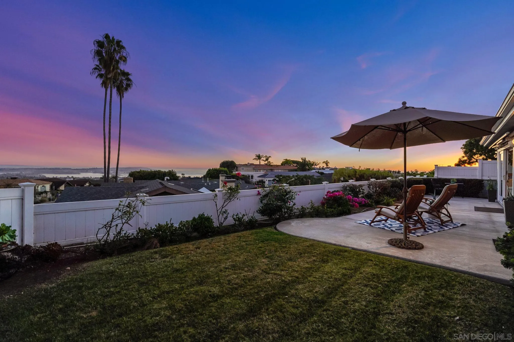 5730 Rutgers Road La Jolla, CA 92037 - Photo 37 of 54 a view of a table and chairs under an umbrella in patio