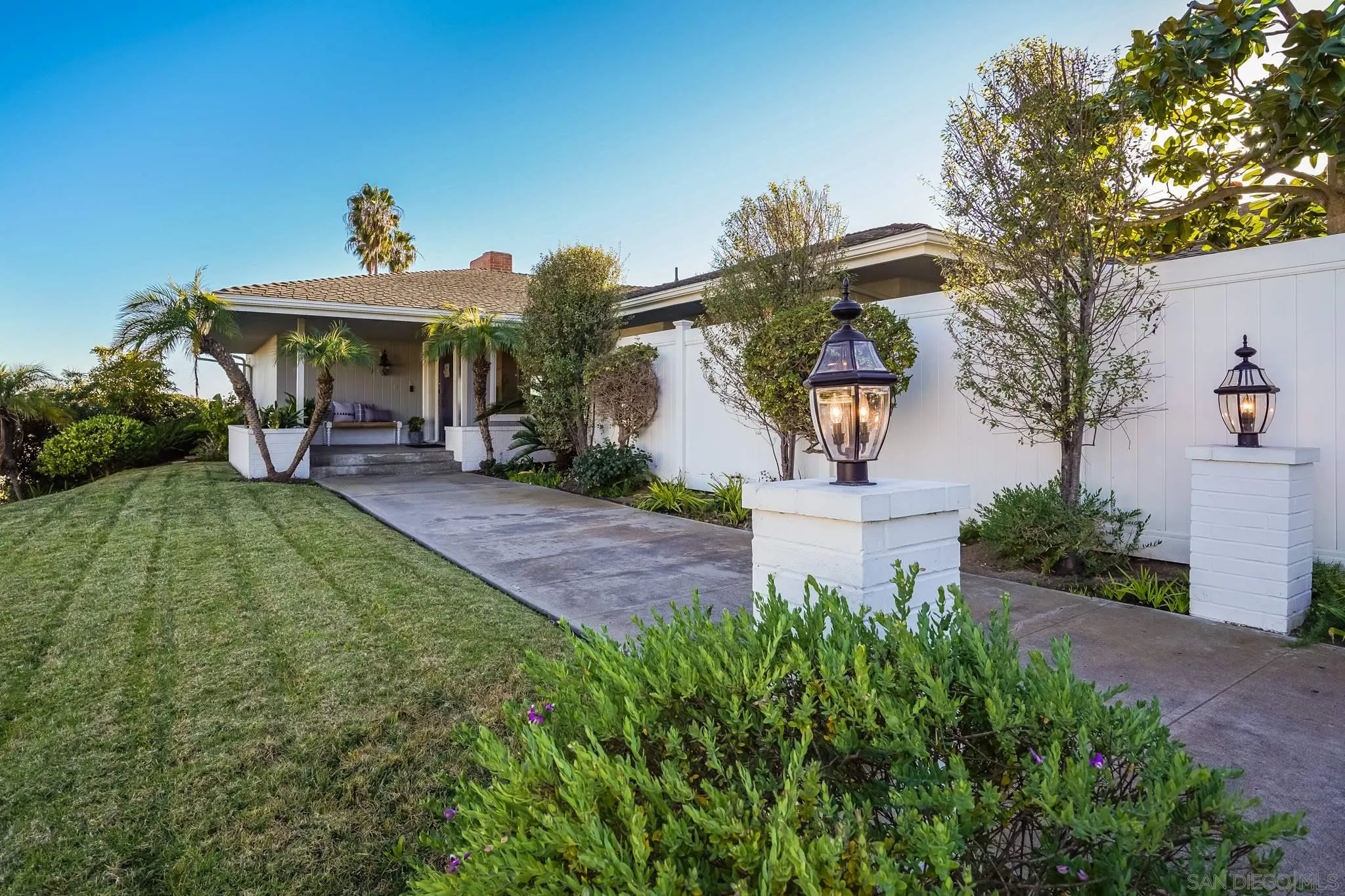 5730 Rutgers Road La Jolla, CA 92037 - Photo 41 of 54 a front view of a house with garden