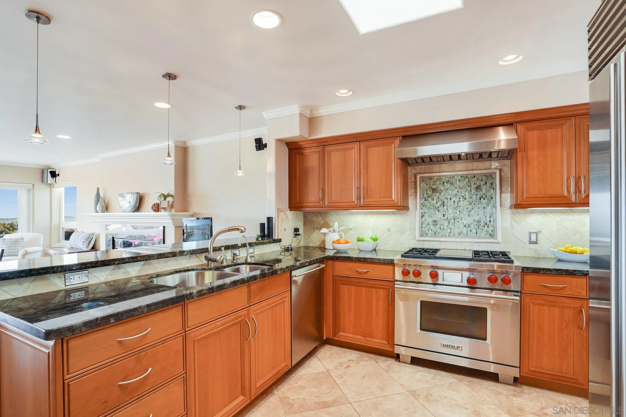 5730 Rutgers Road La Jolla, CA 92037 - Photo 45 of 54 a kitchen with stainless steel appliances granite countertop a sink stove and cabinets