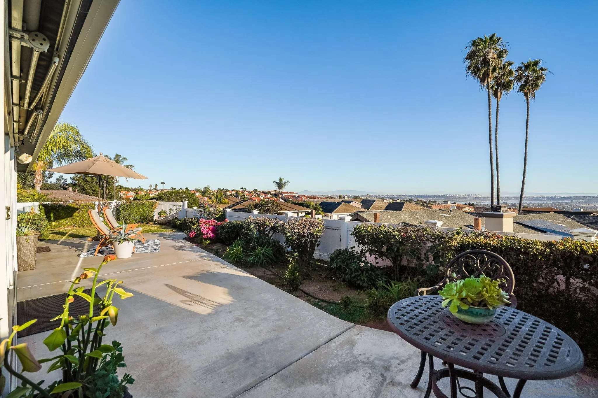 5730 Rutgers Road La Jolla, CA 92037 - Photo 46 of 54 a view of a chairs and table in patio with potted plants
