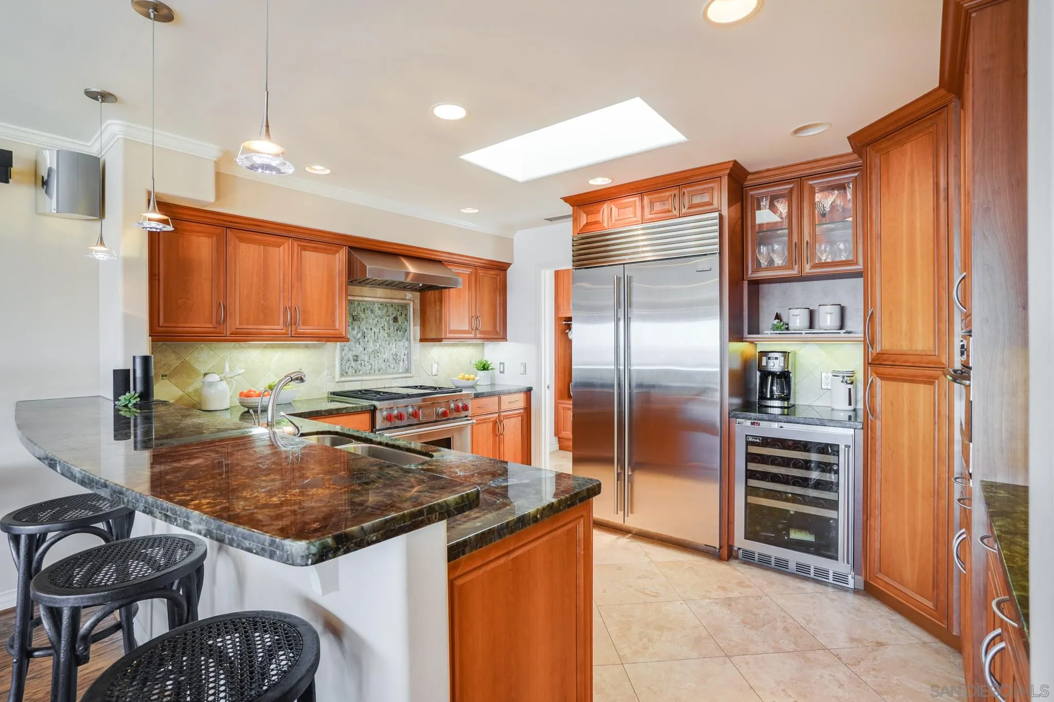 5730 Rutgers Road La Jolla, CA 92037 - Photo 50 of 54 a kitchen with a refrigerator and a sink