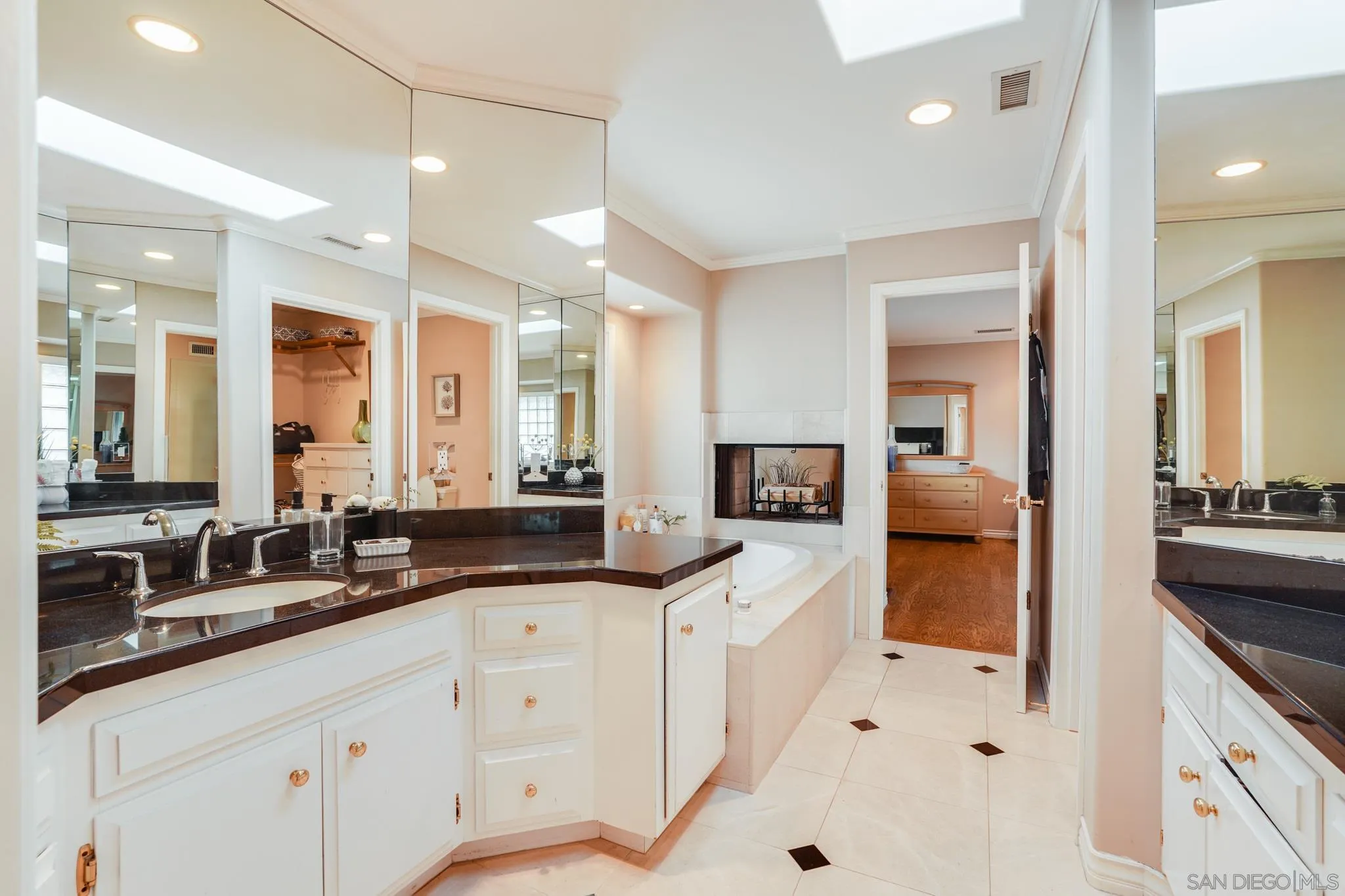 5730 Rutgers Road La Jolla, CA 92037 - Photo 51 of 54 a large white kitchen with granite countertop a sink and white cabinets
