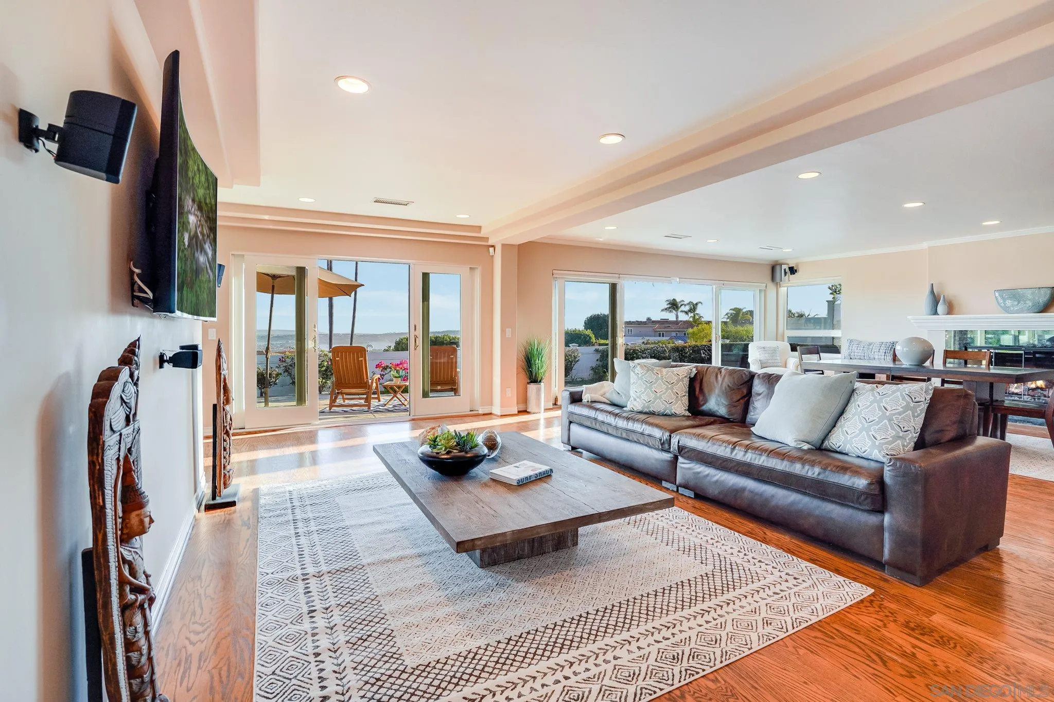 5730 Rutgers Road La Jolla, CA 92037 - Photo 52 of 54 a living room with furniture fireplace and a flat screen tv
