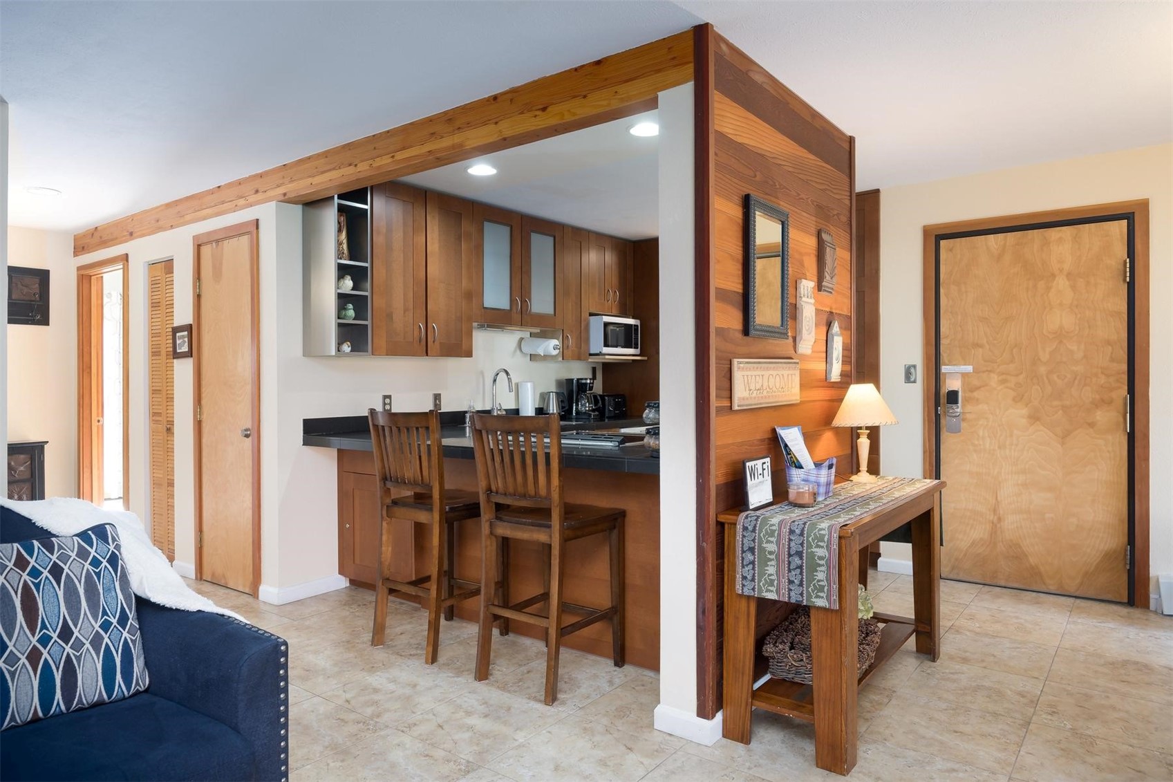 91100 Ryan Gulch Road, Unit 91105 Silverthorne, CO 80498 - Photo 7 of 49 a dining room with furniture and a window