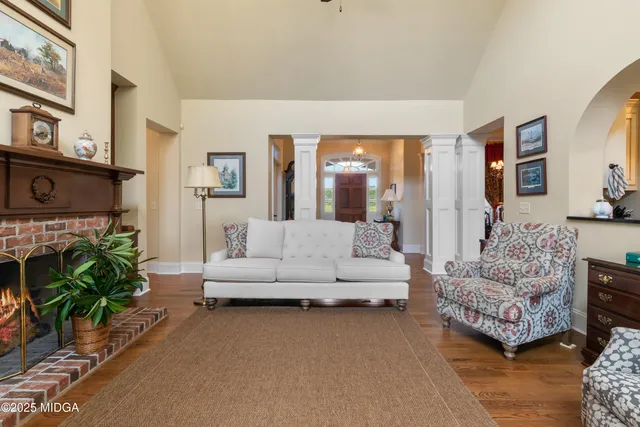 a bathroom with a granite countertop sink a mirror and shower