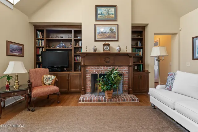 a bathroom with a granite countertop toilet a sink and shower