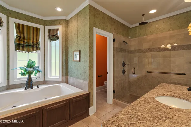 a bedroom with a bed and a dresser in it