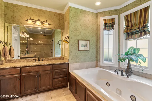 a bedroom with a bed and a dresser in it