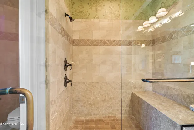 a view of a livingroom with walk in closet and window