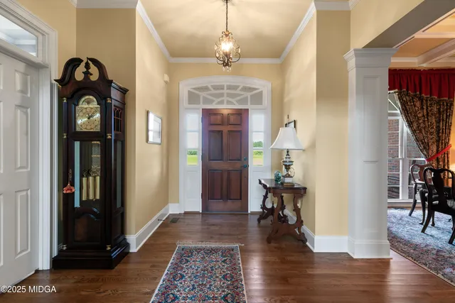 a kitchen with granite countertop a sink a stove and cabinets