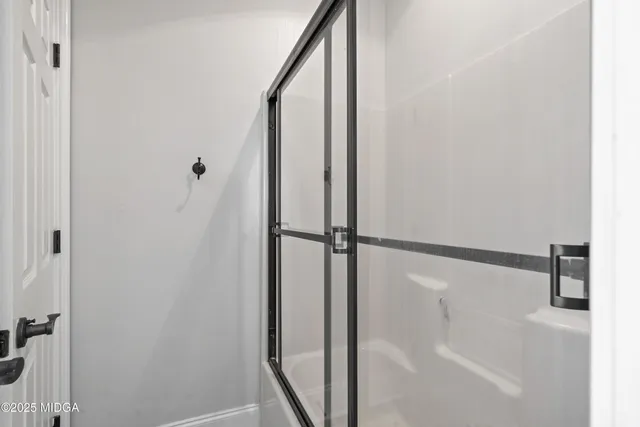 a backyard of a house with lots of green space and garage