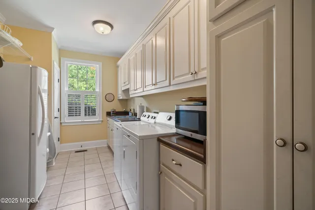 a backyard of a house with lots of green space and lake view