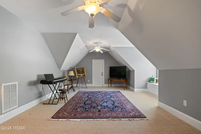 a view of a lake with couches in the patio