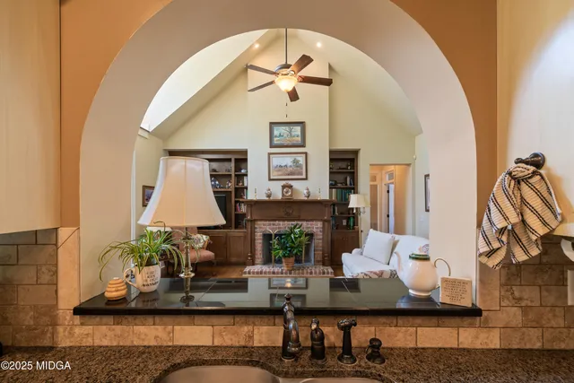a living room with furniture and a floor to ceiling windows