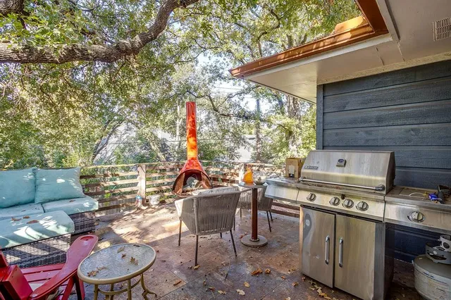 a view of a patio in the backyard