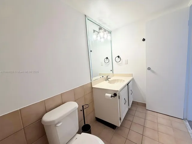 a utility room with sink dryer and washer