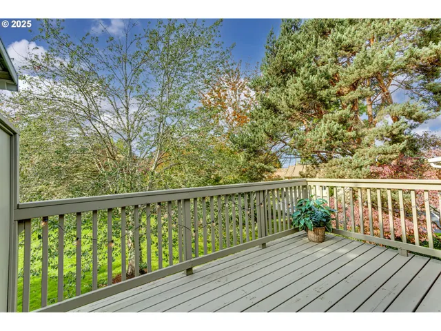 a view of balcony with wooden floor