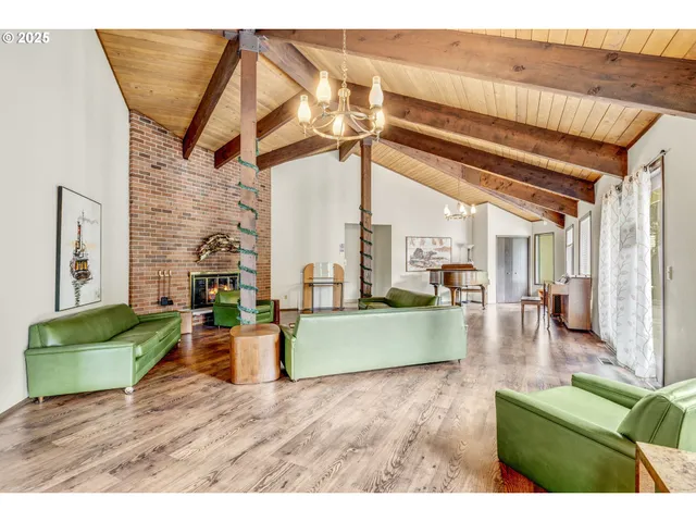 a living room with furniture a window and a table