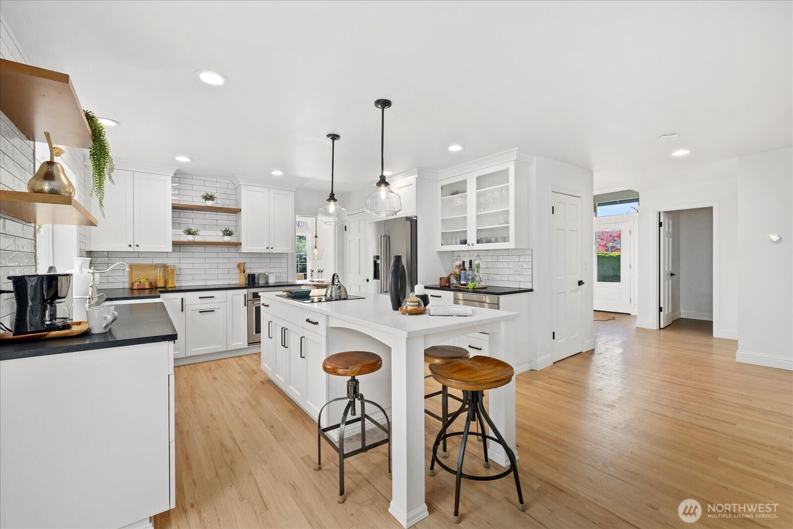 10906 Northeast 197th Street Bothell, WA 98011 - Photo 12 of 38 a kitchen with stainless steel appliances granite countertop counter space a sink refrigerator and cabinets