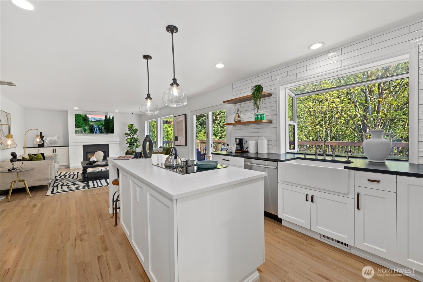 10906 Northeast 197th Street Bothell, WA 98011 - Photo 14 of 38 a kitchen with sink stove and white cabinets with wooden floor