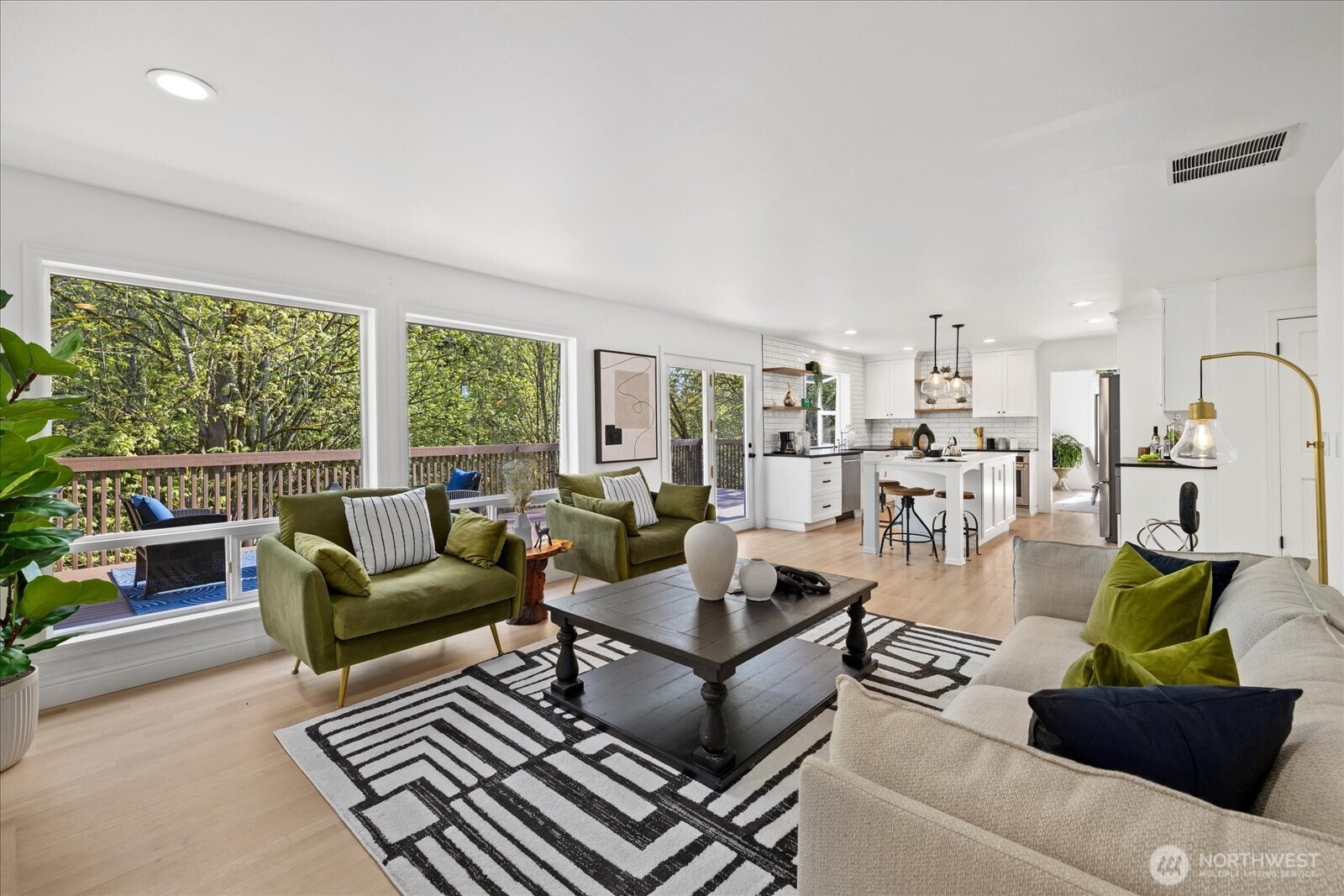10906 Northeast 197th Street Bothell, WA 98011 - Photo 18 of 38 a living room with furniture and a floor to ceiling window