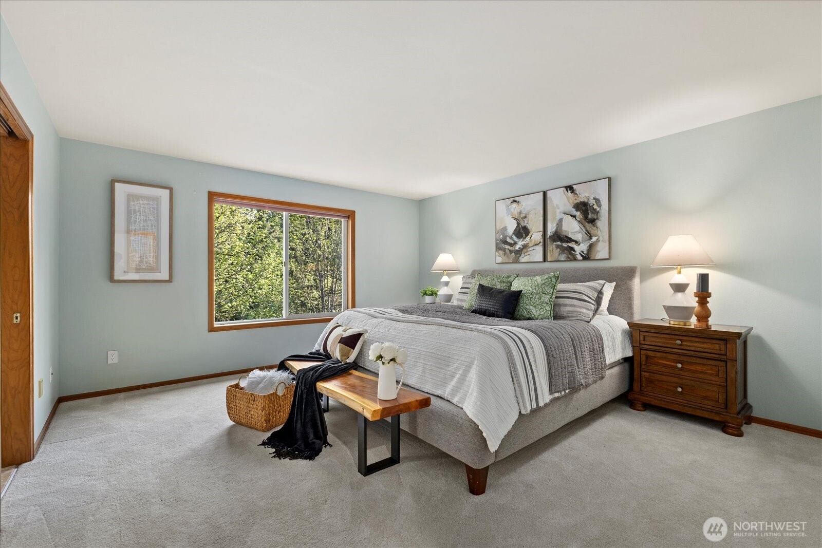 10906 Northeast 197th Street Bothell, WA 98011 - Photo 23 of 38 a spacious bedroom with a bed and window