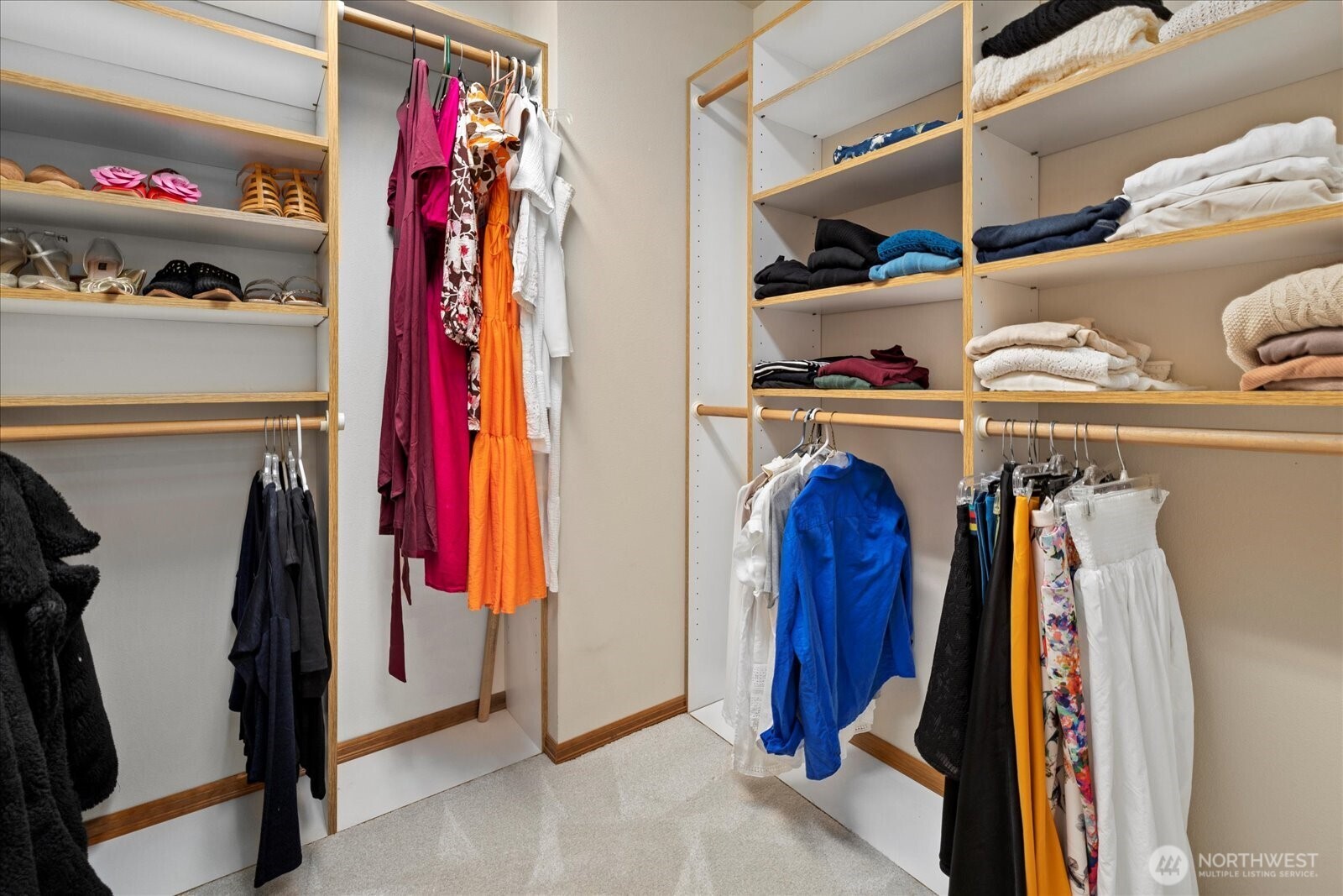 10906 Northeast 197th Street Bothell, WA 98011 - Photo 25 of 38 a view of walk in closet with clothes and shoes