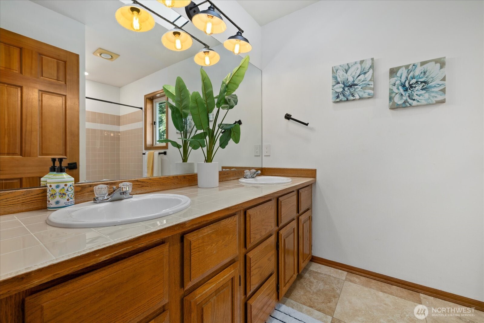 10906 Northeast 197th Street Bothell, WA 98011 - Photo 29 of 38 a bathroom with a sink and a mirror