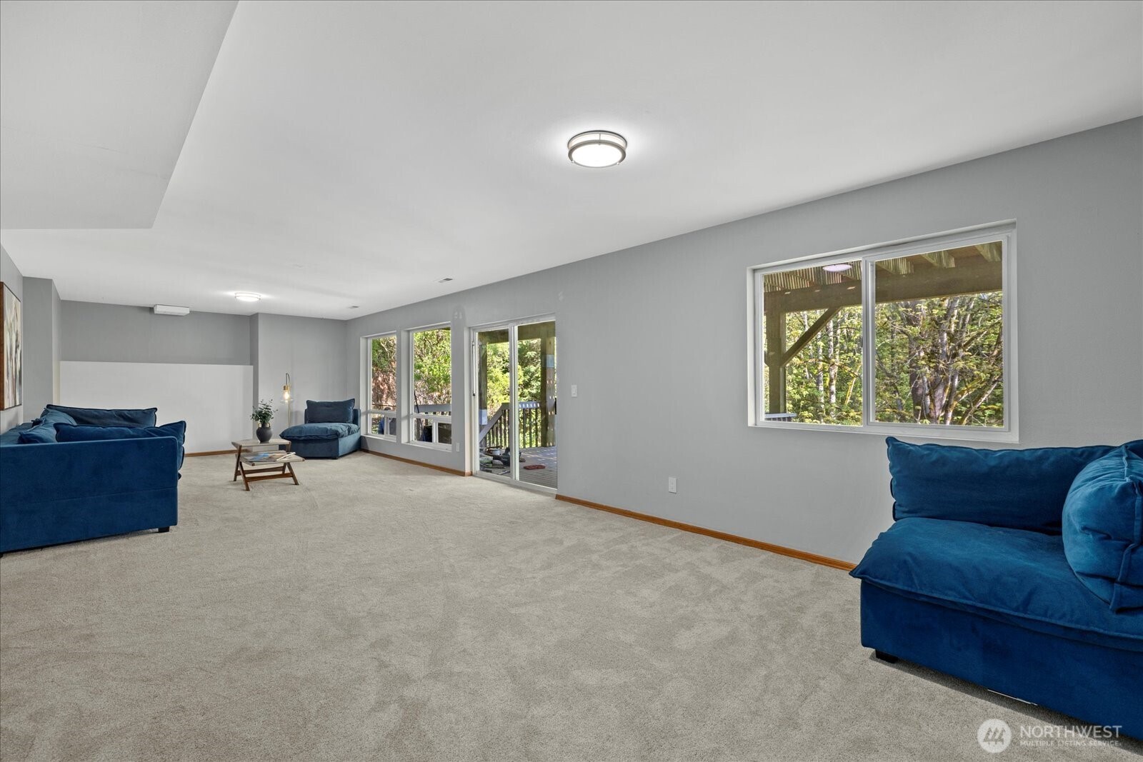 10906 Northeast 197th Street Bothell, WA 98011 - Photo 30 of 38 a living room with furniture and a window