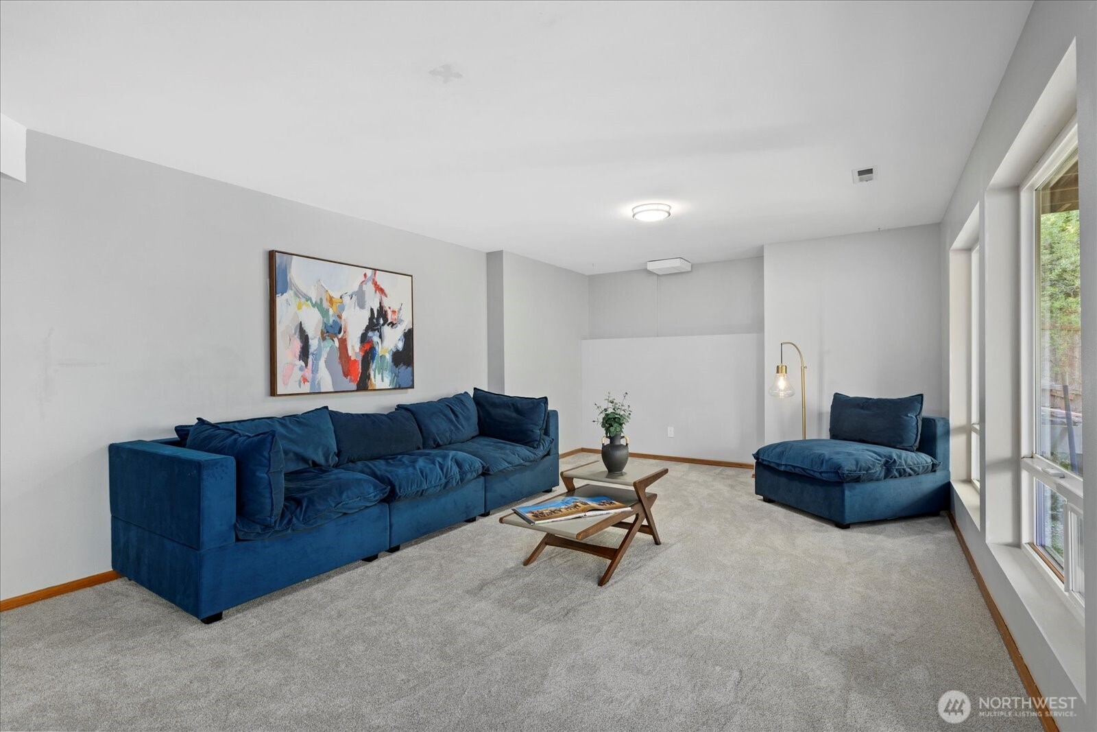 10906 Northeast 197th Street Bothell, WA 98011 - Photo 31 of 38 a living room with furniture and a air conditioner vent