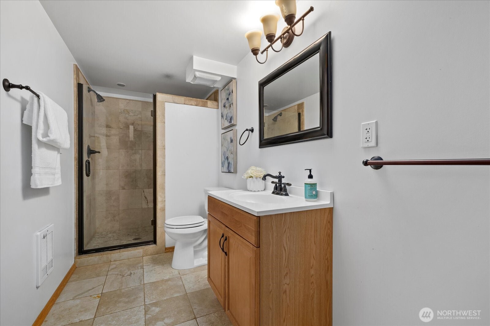 10906 Northeast 197th Street Bothell, WA 98011 - Photo 33 of 38 a bathroom with a sink a toilet and shower