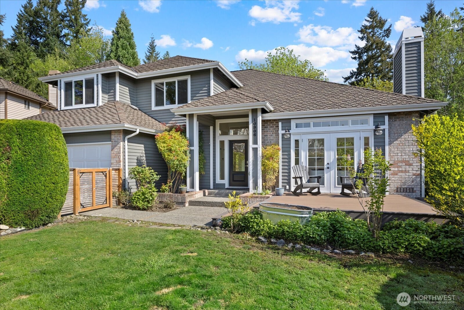 10906 Northeast 197th Street Bothell, WA 98011 - Photo 37 of 38 a front view of a house with yard and green space