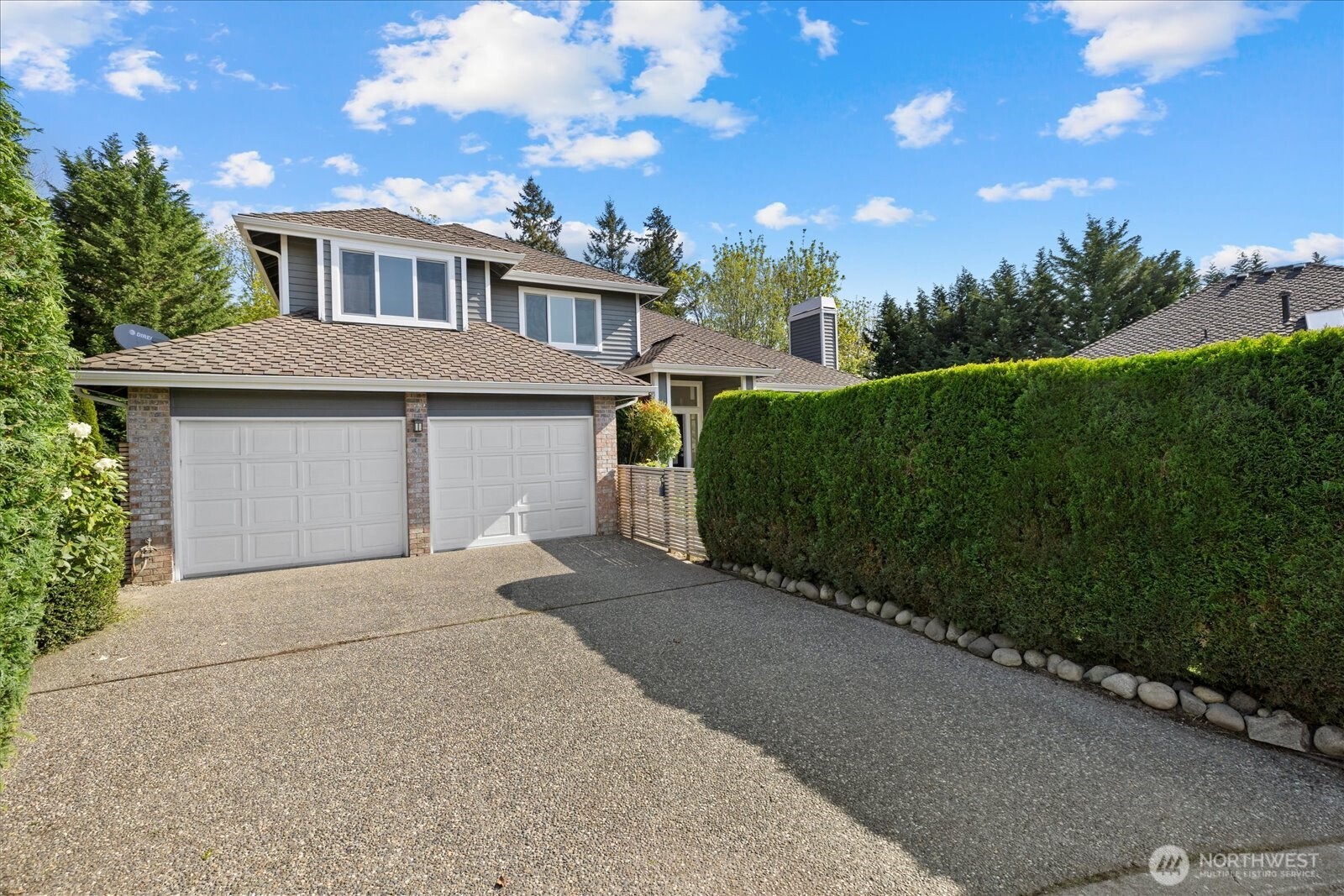 10906 Northeast 197th Street Bothell, WA 98011 - Photo 38 of 38 a front view of a house with a yard and garage