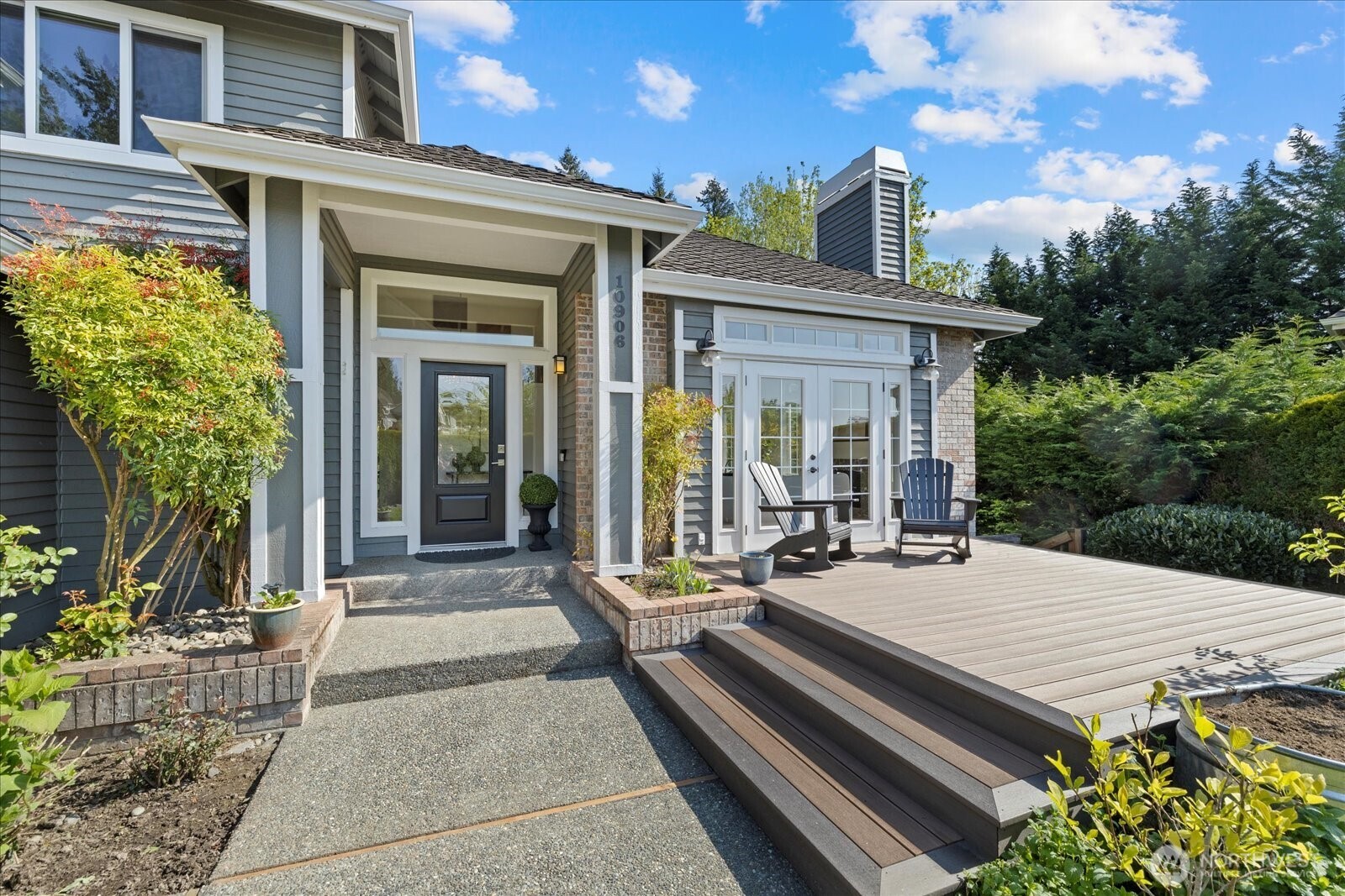 10906 Northeast 197th Street Bothell, WA 98011 - Photo 4 of 38 a view of a patio with table and chairs and potted plants