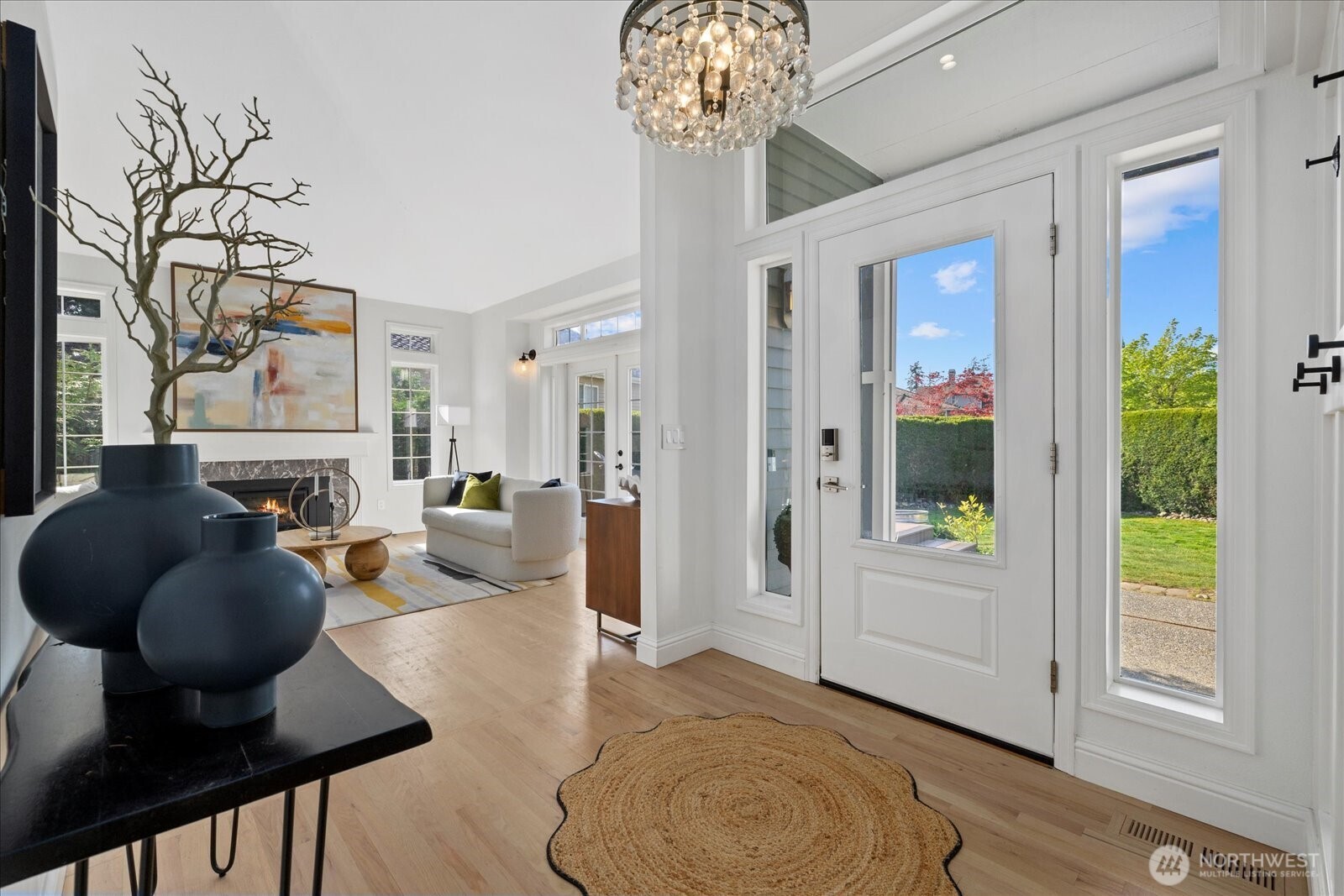 10906 Northeast 197th Street Bothell, WA 98011 - Photo 5 of 38 a living room with furniture and a chandelier
