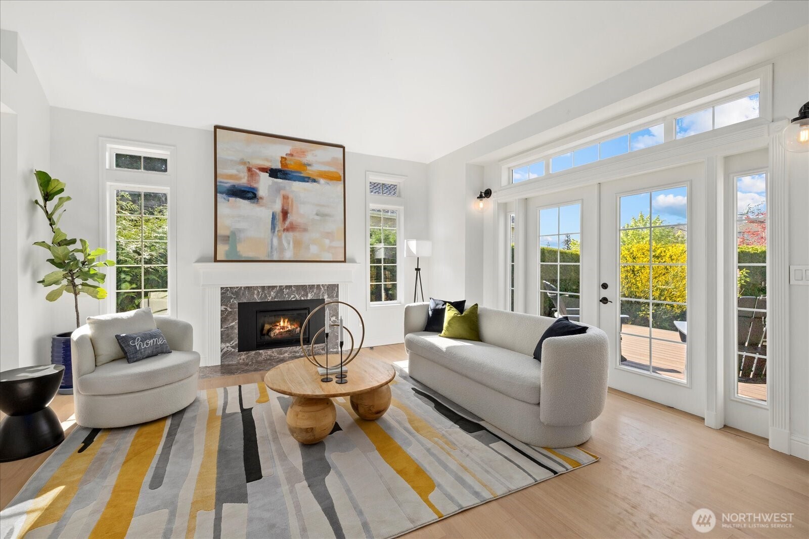 10906 Northeast 197th Street Bothell, WA 98011 - Photo 6 of 38 a living room with furniture and a fireplace
