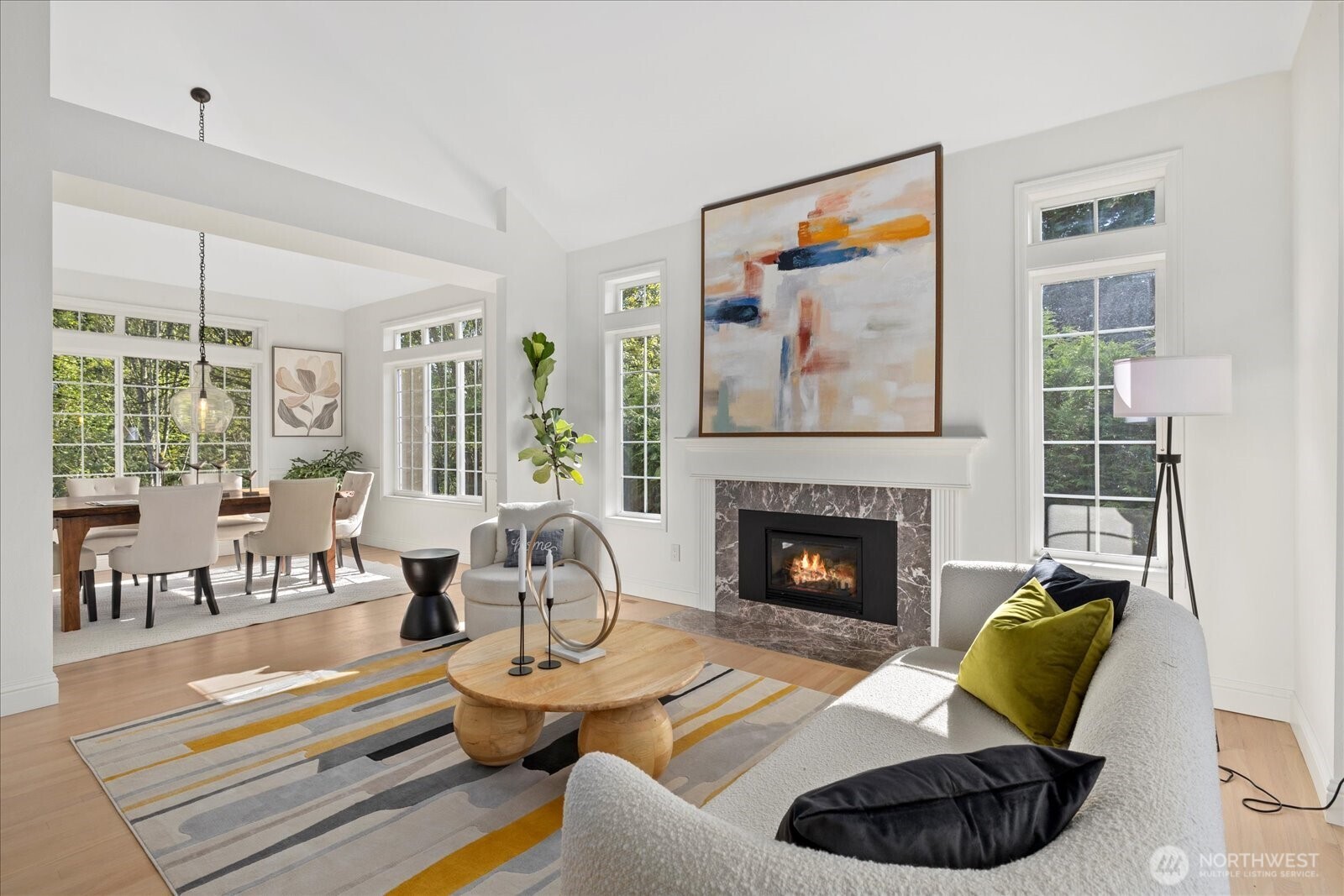 10906 Northeast 197th Street Bothell, WA 98011 - Photo 7 of 38 a living room with furniture and a fireplace